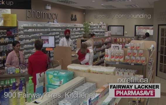 Customers talking to the pharmacist inside Fairway Lackner Pharmacy